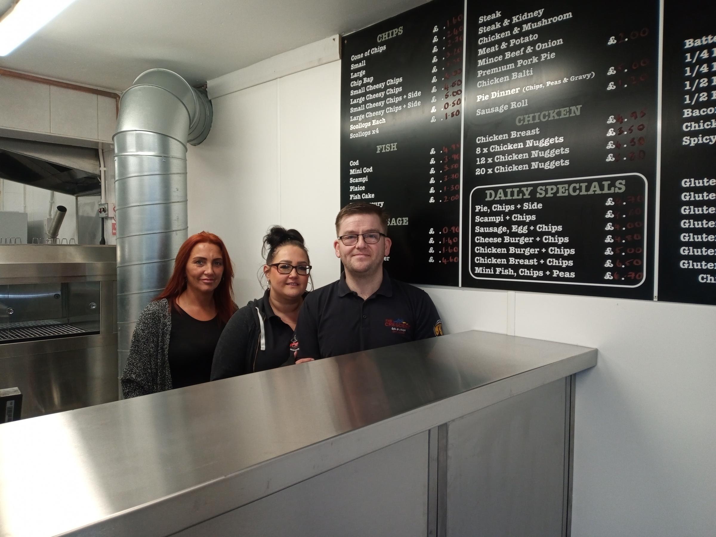 Chris Blackwell (right), with staff members Gemma Green and Lisa Jones at Crescent Fish and Chip Shop in Flint.