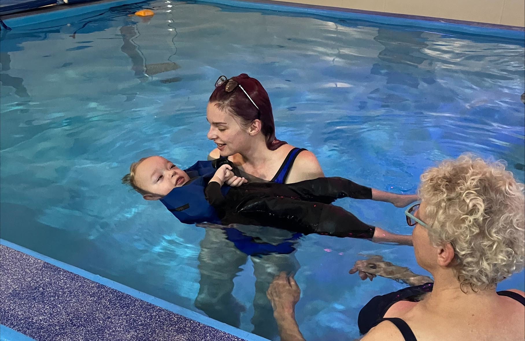 Laura Williams with son Theo for his first swim.