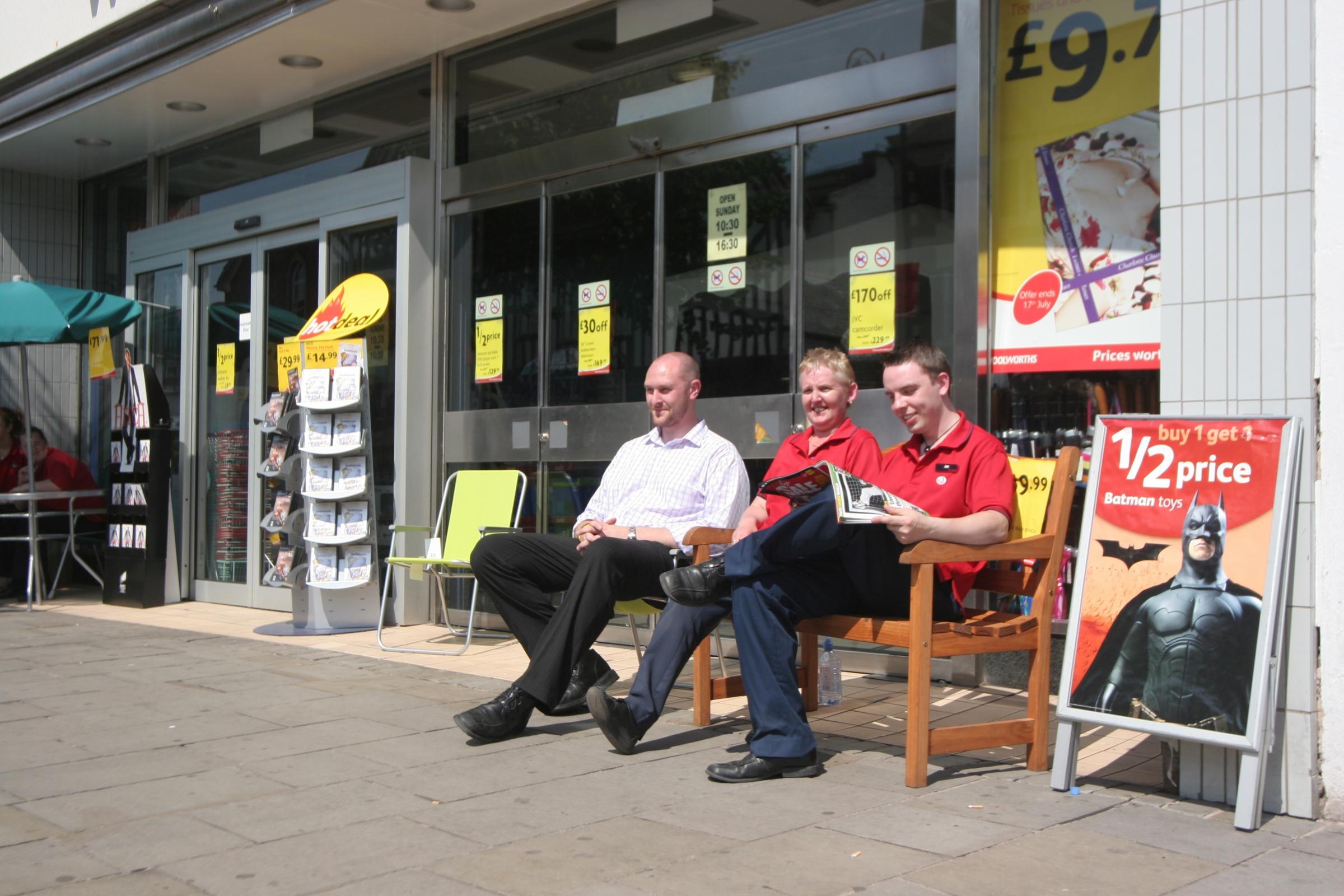 Mold Woolworths staff make the most of the sunshine as the store is plunged into darkness during a town centre power cut - store manager Chris Gregson, Susan Jones and Jez Griffith.
