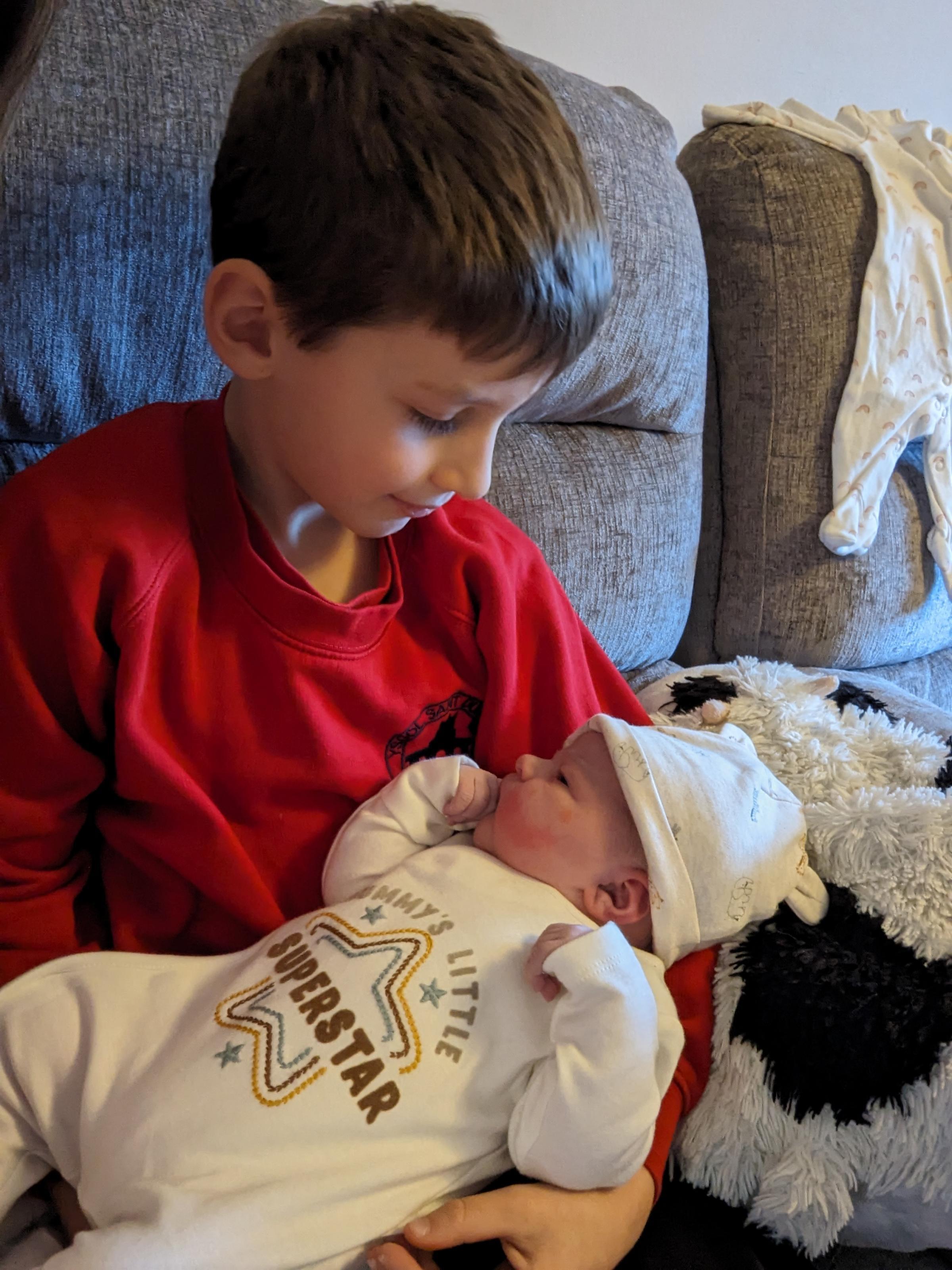 Big brother Oliver came home from school to a long anticipated sister.