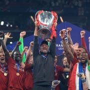 Liverpool manager Jurgen Klopp lifts the trophy with his team after winning the UEFA Champions League Final at the Wanda Metropolitano, Madrid.