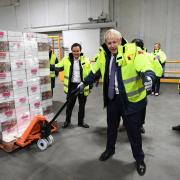 Prime Minister Boris Johnson hauling a consignment of frozen desserts, during a visit to Iceland Foods HQ, Deeside, North Wales, while on the General Election campaign trail around the country. PA Photo. Picture date: Friday November 8, 2019. See PA