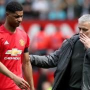 Manchester United's Marcus Rashford (left) with Manchester United manager Jose Mourinho after the final whistle during the Premier League match at Old Trafford, Manchester..