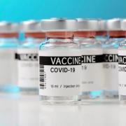 Wales becomes first UK nation to vaccinate half of population.