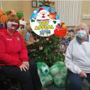 Kerry Evans, official disability liaison officer at Wrexham AFC, meets North Wales Superkids founder Margaret Williams at the grotto in 2020.