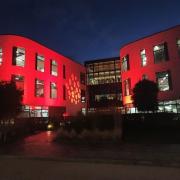 The Moneypenny building coloured red for Remembrance.