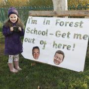 Reception Pupils enjoy using their new outdoor forest school at Ysgol Gwynedd in Flint