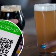 Covid passes could be extended to pubs and restaurants in Wales.