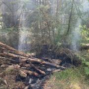 The smouldering fire at Coed Moel Famau (image: Denbighshire County Council)