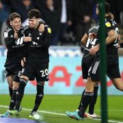 Fulham's Neco Williams (second left) celebrates scoring their side's fourth goal of the game during the Sky Bet Championship match at the Swansea.com Stadium, Swansea. Picture date: Tuesday March 8, 2022..