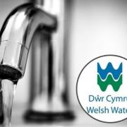 A tap and Welsh Water's logo.