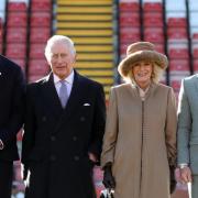 Ryan Reynolds, King Charles III, Queen Consort and Rob McElhenney at The Racecourse Ground, home of Wrexham AFC.