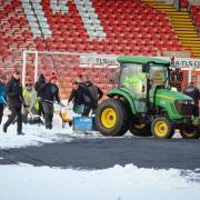 Snow being cleared from the Racecourse this morning.