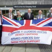 Members of Flintshire County Council gathered at Mold's County Hall to show their support for Armed Forces week.