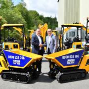 JCB Global Major Accounts MD Steve Fox (left) pictured with Jewson Business Development Director Mark Esling with the new fleet of JCB machines.