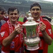 MANCHESTER UNITED GOALSCORERS MARK HUGHES [L] AND ERIC CANTONA SHOW OFF THE FA CUP AT WEMBLEY, AFTER THEIR TEAM BEAT CHELSEA 4-0  IN 1994..