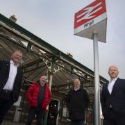 Rail campaigners - Ashley Rogers (right) with Adam Williams, Sean Taylor and Jim Jones. Photo: Mandy Jones