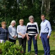 Chirk Hospital Circle of Friends members Dot Griffiths, Janes Davies, Barbara Humphries and Jackie Allen, with MS Ken Skates (right).