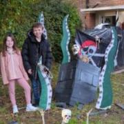 Dewi Bridge, aged 11, and Olivia Rees-Jones, 10, designed the legendary Kraken creature in their garden in Mostyn.