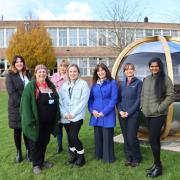The 'Nature-based Social Prescribing' project team pictured by one of the new pods.