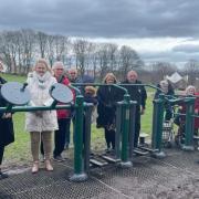 The committee introducing the inclusive equipment at Ponciau Park