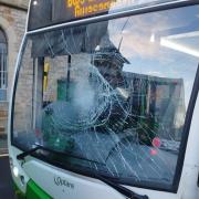 The damaged bus following the incident.