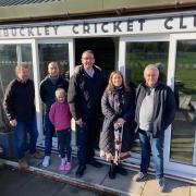 PACT Manager David Evans (left) and North Wales Police and Crime Commissioner Andy Dunbobbin (centre) with members of Buckley Cricket Club.