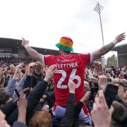 Steven Fletcher with fans on the pitch celebrating promotion to League One