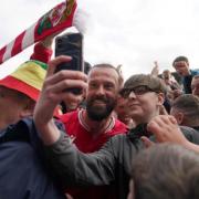 Steven Fletcher celebrates with a supporter.