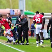 Wrexham wing-back Jacob Mendy goes off at Colchester