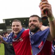 Wrexham AFC stars Paul Mullin and Elliot Lee enjoy their promotion from EFL League Two.