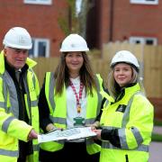 Eoin O’Donnell and Emma Jenrick, from Castle Green Partnerships, handing over the first affordable homes at Llys y Coed, Rhosrobin to Lauren Eaton-Jones, from North Wales Housing Association