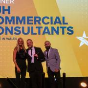 HJH Commercial Consultants directors Dylan Johnson (right) and Daniel Harris (centre) collect their award from host Tess Daly.