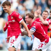 Wrexham's Max Cleworth and Wrexham's James McClean celebrate after the final whistle during the Sky Bet League Two match at JobServe Community Stadium, Colchester. Picture date: Saturday April 6, 2024. PA Photo. See PA story SOCCER Colchester.