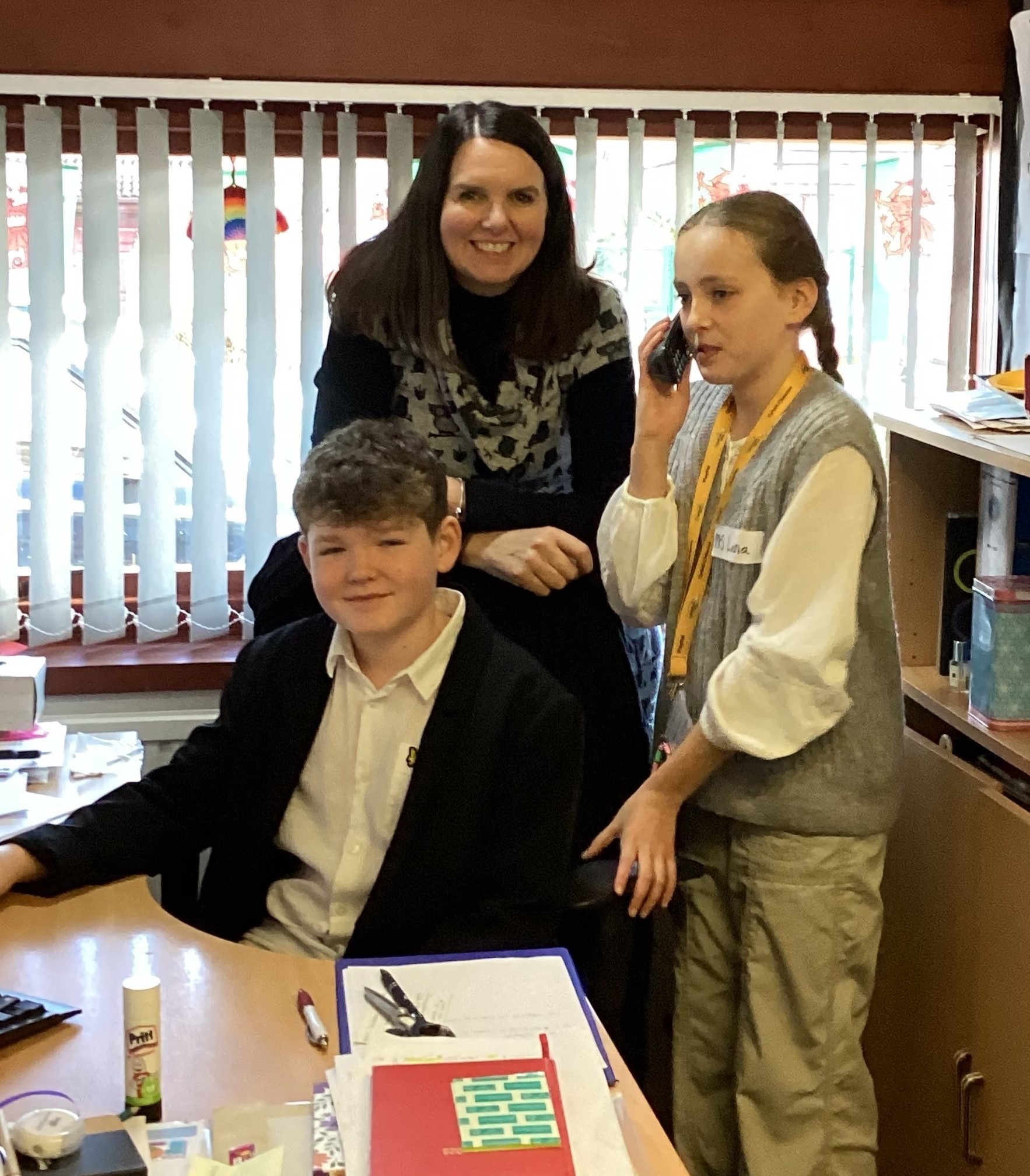 Headteacher Lynne Harrison with the two Year 6 pupils, being headteacher for a day.