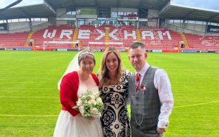 The happy couple, Chris and Debbie Robberts, on their wedding day at the Wrexham AFC racecourse with Amy Dowden