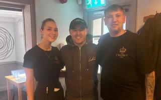 Alan Halsall with staff members Enya Jones and Will Gregory at The Crown Inn Trelawnyd