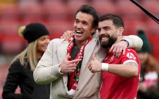 Wrexham co-chairman Rob McElhenney (left) and Wrexham's Elliot Lee celebrate on the pitch after the Sky Bet League Two match at the SToK Cae Ras, Wrexham. Picture date: Saturday April 27, 2024. PA Photo. See PA story SOCCER Wrexham. Photo credit