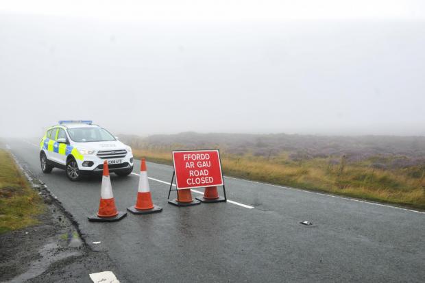 The Horseshoe Pass towards Llangollen remains closed as firefighters continue to tackle the three-week blaze.